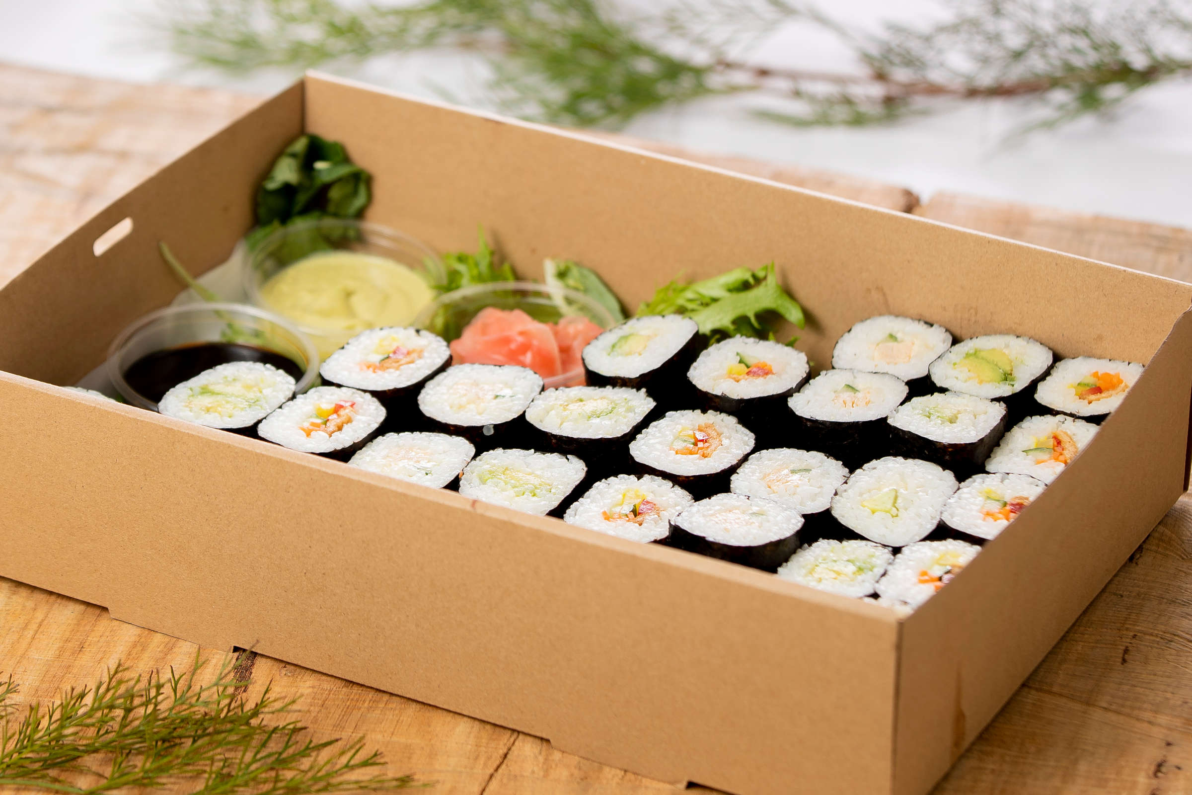 Sushi box containing 32 pieces of vegan and vegetarian sushi with soy sauce. Credit: Richard Jupe.